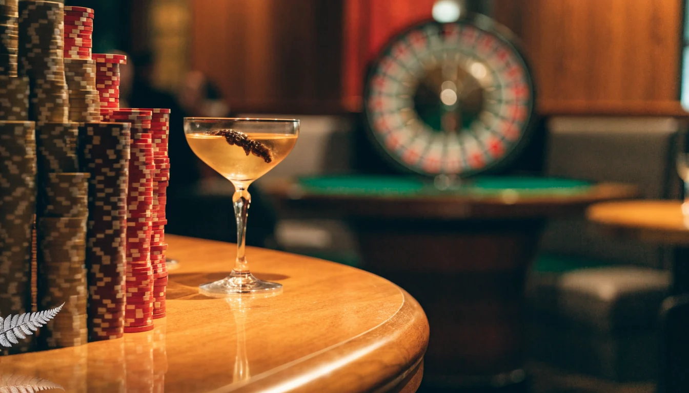 Casino chips and roulette wheel in a New Zealand lounge setting